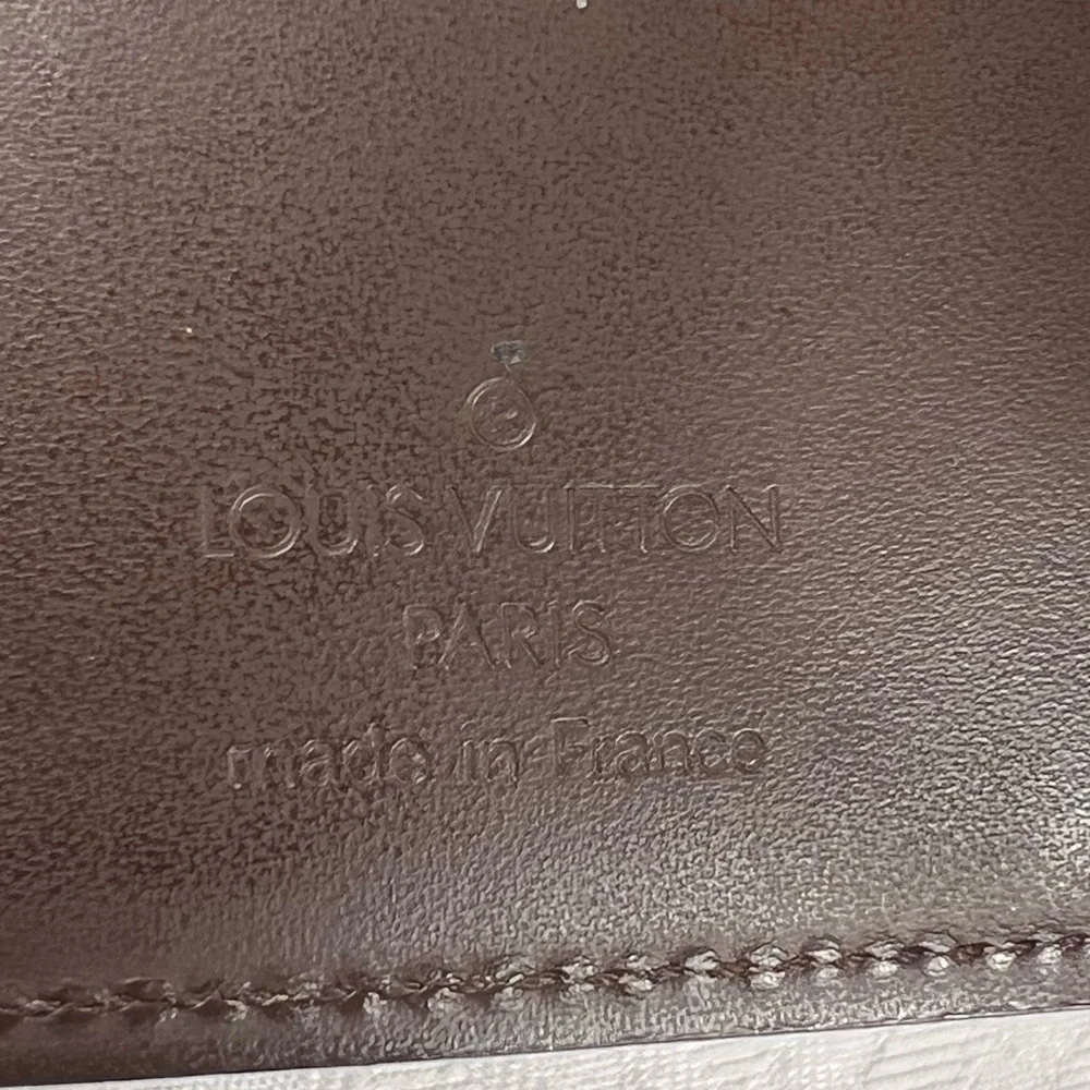 1083: Louis Vuitton Vintage Brown Epi Leather Compact Wallet